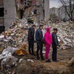 
              Residents look at their house destroyed by a Russian bomb in Chernihiv on Friday, April 22, 2022. (AP Photo/Emilio Morenatti)
            