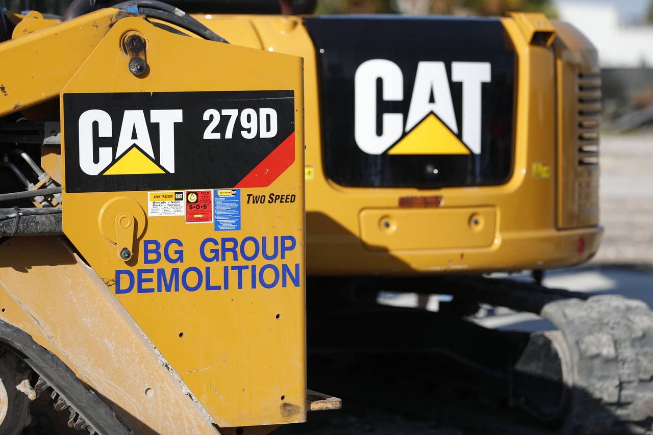 FILE - This May 8, 2019 photo shows a Caterpillar 279D Compact Track Loader, left, and 308E2 CR Min...