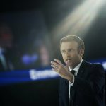 
              French President Emmanuel Macron and centrist candidate for reelection delivers his speech during a meeting in Paris, Saturday, April 2, 2022. France's first round of the presidential election will take place on April 10, with a presidential runoff on April 24 if no candidate wins outright. (AP Photo/Francois Mori)
            