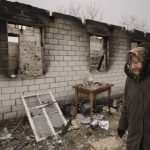 
              A woman walks by a house destroyed while her village was occupied by Russian troops in Andriivka, Ukraine, Tuesday, April 5, 2022. Ukrainian President Volodymyr Zelenskyy accused Russian troops of gruesome atrocities in Ukraine and told the U.N. Security Council on Tuesday that those responsible should immediately be brought up on war crimes charges in front of a tribunal like the one set up at Nuremberg after World War II.(AP Photo/Vadim Ghirda)
            
