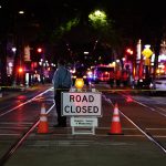 
              A roadblock is set a block away from the scene of an apparent mass shooting in Sacramento, Calif., Sunday, April 3, 2022. (AP Photo/Rich Pedroncelli)
            