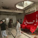 
              People visit Kusha Kisaldar Shiite Mosque, the site of March 4 suicide bombing, to offer prays for bombing victims, in Peshawar, Pakistan, Wednesday, March 9, 2022. In northwest Pakistan the remains of an IS suicide bomber are still visible on the once ornate walls of a mosque where last month more than 63 worshippers died as they knelt in prayer. The bomber, an Afghan identified by IS as Julaybib al-Kabuli, was from the capital Kabul. (AP Photo/Muhammad Sajjad)
            