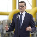 
              Poland's Prime Minister Mateusz Morawiecki speaks to media at the gas station of Gaz-System in Rembelszczyzna, near Warsaw, Poland, Wednesday, April 27, 2022. Polish and Bulgarian leaders accused Moscow of using natural gas to blackmail their countries after Russia's state-controlled energy company stopped supplying the two European nations Wednesday. (AP Photo/Czarek Sokolowski)
            
