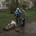 
              A woman cries next to the body of her father lying on the ground after a Russian attack in Kharkiv, Ukraine, Monday, April 18, 2022. (AP Photo/Felipe Dana)
            