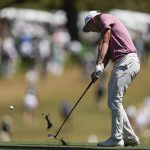 
              Cameron Smith, of Australia, hits on the first fairway during the final round at the Masters golf tournament on Sunday, April 10, 2022, in Augusta, Ga. (AP Photo/Robert F. Bukaty)
            