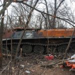 
              A destroyed armoured vehicle is seen near the village of Malaya Rohan, Kharkiv region, Ukraine, Friday, April 1, 2022. (AP Photo/Andrew Marienko)
            