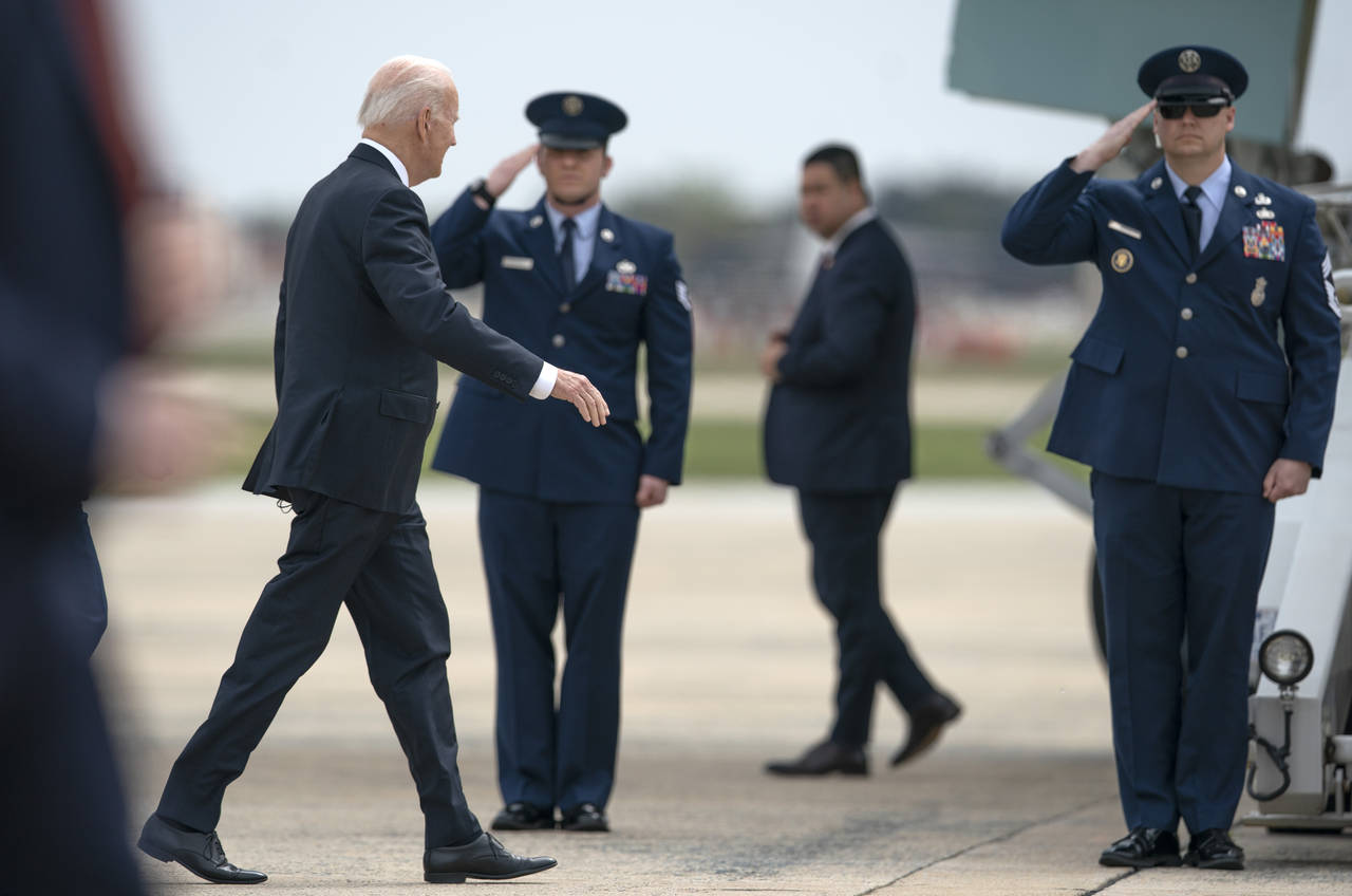 President Joe Biden walks to board Air Force One, Thursday, April 21, 2022, at Andrews Air Force Ba...
