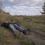 
              The lifeless body of a man lies on a dirt path in Bucha, Ukraine, Monday, April 4, 2022. Russia faced a fresh wave of condemnation on Monday after evidence emerged of what appeared to be deliberate killings of civilians in Ukraine. Some Western leaders called for further sanctions in response, even as Moscow continued to press its offensive in the country's east. (AP Photo/Vadim Ghirda)
            