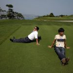 
              FILE - Visitors enjoy the manicured lawn at the South Korean-owned golf course at the Mount Kumgang resort, also known as Diamond Mountain, in North Korea on Sept. 1, 2011. North Korea is destroying the golf course in the second confirmed case of South Korean assets being eliminated in an area where the rivals once ran a joint tour program, officials said Tuesday, April 12, 2022, in Seoul. (AP Photo/Ng Han Guan, File)
            