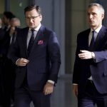 
              Ukraine's Foreign Minister Dmytro Kuleba, left, walks with NATO Secretary General Jens Stoltenberg as they arrive for a meeting of NATO foreign ministers at NATO headquarters in Brussels, Thursday, April 7, 2022. NATO foreign ministers are meeting to discuss how to bolster their support to Ukraine, including by supplying weapons to the conflict-torn country, without being drawn into a wider war with Russia. (AP Photo/Olivier Matthys)
            