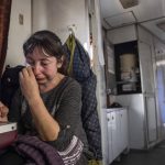 
              A woman from Luhansk region cries while sitting on the evacuation train in Pokrovsk, eastern Ukraine, Tuesday, April 26, 2022. (AP Photo/Evgeniy Maloletka)
            