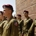 
              Israeli soldiers attend the ceremony marking Holocaust Remembrance Day at Warsaw Ghetto Square at the Yad Vashem memorial in Jerusalem, Thursday, April 28, 2022. (Amir Cohen/Pool Photo via AP)
            