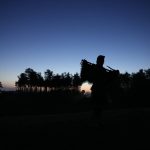 
              A piper is silhouetted against the trees of Polygon Wood during an ANZAC Day dawn service at Buttes New British Cemetery in Zonnebeke, Belgium on Monday, April 25, 2022. ANZAC Day is a national day of remembrance in Australia and New Zealand for those who served in all wars. (AP Photo/Virginia Mayo)
            