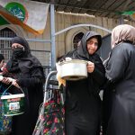 
              People receive free food being distributed ahead of Iftar, the evening meal breaking the Ramadan fast, at the Abdul-Qadir al-Gailani mosque in Baghdad, Iraq, Saturday, April 2, 2022. Muslims throughout the world are marking the Ramadan -- a month of fasting during which observants abstain from food, drink and other pleasures from sunrise to sunset. (AP Photo/Hadi Mizban)
            