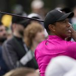 
              Tiger Woods watches his tee shot on the first hole during the first round at the Masters golf tournament on Thursday, April 7, 2022, in Augusta, Ga. (AP Photo/Charlie Riedel)
            