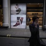 
              A man walks past a shoe store on Oxford Street, in London, Friday, April 1, 2022. Energy costs for millions of households in the UK are set to rise by 54% on Friday. It is the second big jump in energy bills since October, and a third may be ahead as rebounding demand from the COVID-19 pandemic and now Russia's war in Ukraine push prices for oil and natural gas higher. (AP Photo/Matt Dunham)
            
