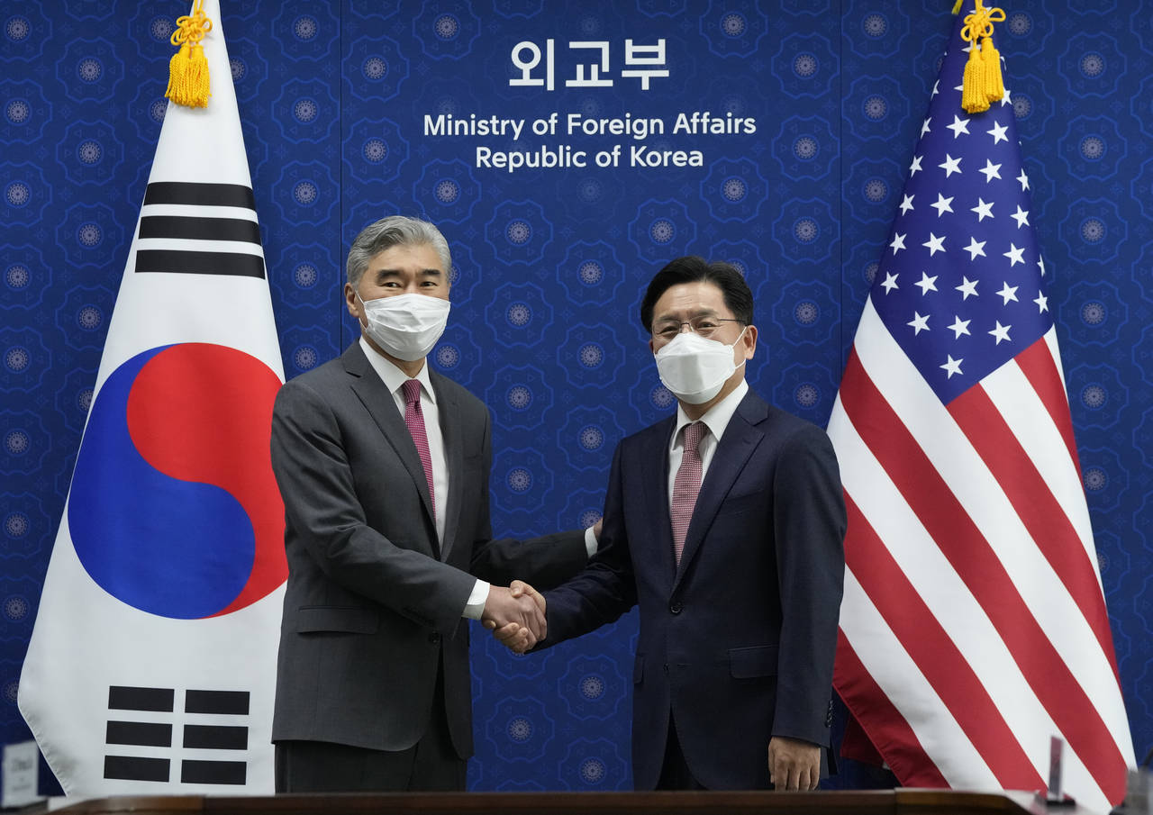 U.S. Special Representative for North Korea, Sung Kim, left, shakes hands with South Korea's Specia...