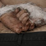 
              A lifeless body of a man with his hands tied behind his back lies on the ground in Bucha, Ukraine, Sunday, April 3, 2022. (AP Photo/Vadim Ghirda)
            