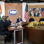 
              President Joe Biden meets virtually with Indian Prime Minister Narendra Modi in the South Court Auditorium on the White House campus in Washington, Monday, April 11, 2022. Secretary of Defense Lloyd Austin, left, and Secretary of State Antony Blinken, second left, and Indian Minister of Defense Rajnath Singh, second right, Minister of External Affairs Subrahmanyam Jaishankar is right. (AP Photo/Carolyn Kaster)
            
