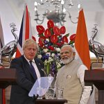 
              India's Prime Minister Narendra Modi, right, shakes hands with his British counterpart Boris Johnson after a joint press conference at Hyderabad House in New Delhi, Friday, April 22, 2022. (Ben Stansall/Pool Photo via AP)
            
