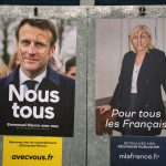 
              Presidential campaign posters of French President and centrist candidate for reelection Emmanuel Macron, left, and French far-right presidential candidate Marine Le Pen, in Salies de Bearn, southwestern France, Saturday, April 23, 2022. French President Emmanuel Macron is facing off against far-right challenger Marine Le Pen in France's April 24 presidential runoff. (AP Photo/Bob Edme)
            