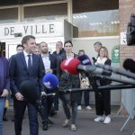 
              Current French President and centrist presidential candidate for reelection Emmanuel Macron and local mayor Anne-Lise Dufour-Tonini arrive to meet the press in Denain, northern France, Monday, April 11, 2022 . French President Emmanuel Macron may be ahead in the presidential race so far, but he warned his supporters that "nothing is done" and his runoff battle with far-right challenger Marine Le Pen will be a hard fight. (AP Photo/Lewis Joly, Pool)
            
