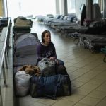 
              Iulia Shevchuk rests in a reception center for displaced people in Dnipro, Ukraine, Thursday, April 28, 2022. (AP Photo/Francisco Seco)
            