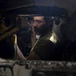 
              An Ukrainian serviceman repairs his tank after fighting against Russian forces in Donetsk region, eastern Ukraine, Wednesday, April 27, 2022. (AP Photo/Evgeniy Maloletka)
            