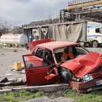 
              A body of a civilian lies next to a damaged car near the Illich Iron & Steel Works Metallurgical Plant, the second largest metallurgical enterprise in Ukraine, in an area controlled by Russian-backed separatist forces in Mariupol, Ukraine, Saturday, April 16, 2022. Mariupol, a strategic port on the Sea of Azov, has been besieged by Russian troops and forces from self-proclaimed separatist areas in eastern Ukraine for more than six weeks. (AP Photo/Alexei Alexandrov)
            