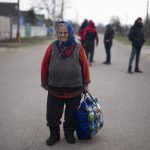 
              An elderly woman arrives at a church, which is used as a shelter, after fleeing from a nearby village that have been attacked by the Russian army, in the town of Bashtanka on Thursday, March 31, 2022. The talks between Ukraine and Russia will resume on Friday as NATO Secretary-General says Russia does not appear to be scaling back its military operations in Ukraine but is instead redeploying forces to the eastern Donbas region. (AP Photo/Petros Giannakouris)
            