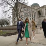 
              Democrat Abby Finkenauer leaves the Iowa Supreme Court Building with her husband Daniel Wasta, Wednesday, April 13, 2022, in Des Moines, Iowa. The Iowa Supreme Court has ruled that  Finkenauer qualifies for the primary ballot, rejecting a lower court decision and allowing her to continue her campaign for the nomination. The court’s decision Friday, April 15, leaves Finkenauer as the likely front-runner in a race with two lesser-known candidates ahead of Iowa’s June 7 primary.   (AP Photo/Charlie Neibergall)
            