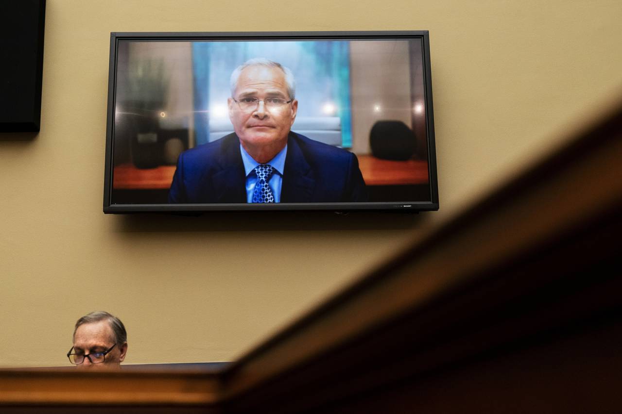 FILE - Darren Woods, CEO of ExxonMobil, testifies via video conference during a House Committee on ...
