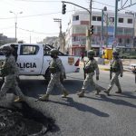 
              Special Forces Police arrive to a checkpoint in the Manchay district, on the outskirts of Lima, Peru, Tuesday, April 5, 2022. Peru’s President Pedro Castillo imposed a curfew on the capital and the country’s main port in response to sometimes violent protests over rising prices of fuel and food, requiring people in Lima and Callao to mostly stay in their homes all of Tuesday. (AP Photo/Martin Mejia)
            