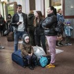 
              Families gather inside the train station in Lviv, Ukraine, Sunday, April 17, 2022. (AP Photo/Rodrigo Abd)
            