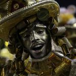 
              A performer from the Viradouro samba school parades during Carnival celebrations at the Sambadrome in Rio de Janeiro, Brazil, Saturday, April 23, 2022. (AP Photo/Bruna Prado)
            