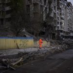 
              Clean-up crews work at the explosion site in Kyiv, Ukraine on Friday, April 29, 2022. Russia struck the Ukrainian capital of Kyiv shortly after a meeting between President Volodymyr Zelenskyy and U.N. Secretary-General António Guterres on Thursday evening. (AP Photo/Emilio Morenatti)
            