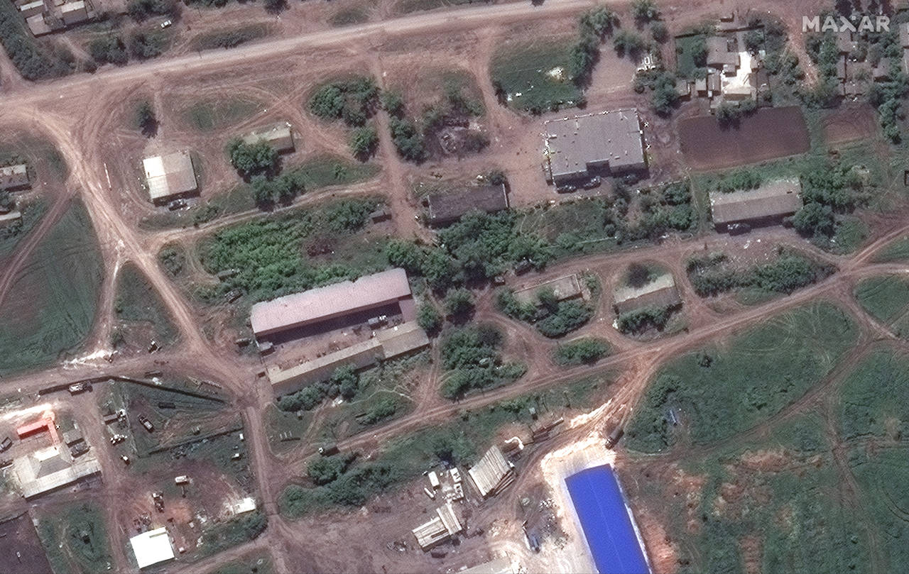 In this satellite image provided by Maxar Technologies, Russian forces are deployed in the town of ...