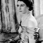 
              FILE - Britain's Queen Elizabeth II, then Princess Elizabeth, wears a silver gown with a diamond tiara and pearl necklace, in this Aug. 30, 1949 photo. (AP Photo, File)
            