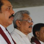 
              FILE - Sri Lanka's former president Mahinda Rajapaksa, left, along with his brothers former defense secretary Gotabaya Rajapaksa, center, and former economics development minister Basil Rajapaksa, attend a meeting at their party office with local politicians in Colombo, Sri Lanka,  July 4, 2018. With one brother president, another prime minister and three more family members cabinet ministers, it appeared that the Rajapaksa clan had consolidated its grip on power in Sri Lanka after decades in and out of government. With a national debt crisis spiraling out of control, it looks like the dynasty is nearing its end with Prime Minister Mahinda stepping down on Monday, May 9, 2022, and the three Rajapaksas resigning their cabinet posts in April, but the family is not going down without a fight. (AP Photo/Eranga Jayawardena, File)
            