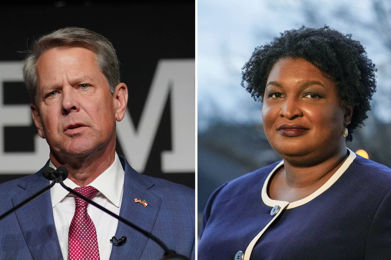 This combination image shows Georgia Gov. Brian Kemp Tuesday, May 24, 2022, in Atlanta, left, and G...