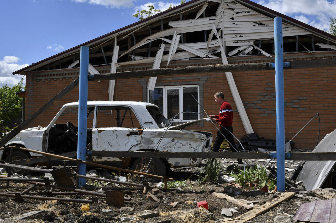 Alexander walks around his house destroyed by Russian shelling in Toretsk, Donetsk region, Ukraine,...