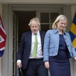 
              British Prime Minister Boris Johnson, left, and Sweden's Prime Minister Magdalena Andersson arrive for a joint press conference in Harpsund, the country retreat of Swedish prime ministers, Wednesday, May 11, 2022. Britain has signed a security assurance with Sweden which like its neighbor Finland is pondering whether to join NATO following Russia's invasion of Ukraine, pledging to "bolster military ties" in the event of a crisis and support both countries should they come under attack.(AP Photo/Frank Augstein, Pool)
            