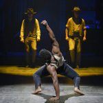 
              This image released by The Press Room shows  Jacobi Hall, center, during a performance of "Paradise Square." (Alessandra Mello/The Press Room via AP)
            