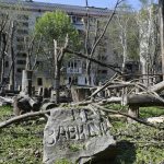 
              A stone with a sign reads "Don't be jealous" is seen in a yard of an apartment building destroyed by night shelling in Kramatorsk, Ukraine, Thursday, May 5, 2022. (AP Photo/Andriy Andriyenko)
            