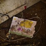 
              A child's drawing lays on the floor of Iryna Martsyniuk's home, heavily damaged after a Russian bombing in Velyka Kostromka village, Ukraine, Thursday, May 19, 2022. Martsyniuk and her three young children were at home when the attack occurred in the village, a few kilometres from the front lines, but they all survived unharmed. (AP Photo/Francisco Seco)
            