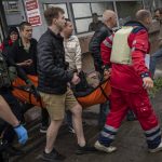 
              An injured man as a result of shelling is carried on a stretcher in Kharkiv, eastern Ukraine, Thursday, May 26, 2022. (AP Photo/Bernat Armangue)
            