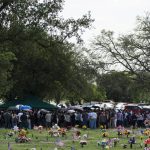
              People gather at a cemetery for a burial service for Amerie Jo Garza in Uvalde, Texas, Tuesday, May 31, 2022. Garza was one of the students killed in last week's shooting at Robb Elementary School. (AP Photo/Jae C. Hong)
            