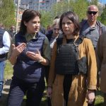 
              German Foreign Minister Annalena Baerbock, right, and Ukrainian Prosecutor General Iryna Venediktova talk as they stand near a mass grave in Bucha, on the outskirts of Kyiv, Ukraine, Tuesday, May 10, 2022. (AP Photo/Efrem Lukatsky)
            