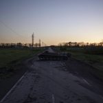 
              A destroyed Russian tank is seen as the sun sets in the village of Vilkhivka, recently retaken by Ukraininan forces near Kharkiv, Ukraine, Monday, May 9, 2022. (AP Photo/Felipe Dana)
            