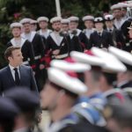 
              French President Emmanuel Macron reviews military troops during the ceremony of his inauguration for a second term at the Elysee palace, in Paris, France, Saturday, May 7, 2022. Macron was reelected for five years on April 24 in an election runoff that saw him won over far-right rival Marine Le Pen. (AP Photo/Lewis Joly)
            